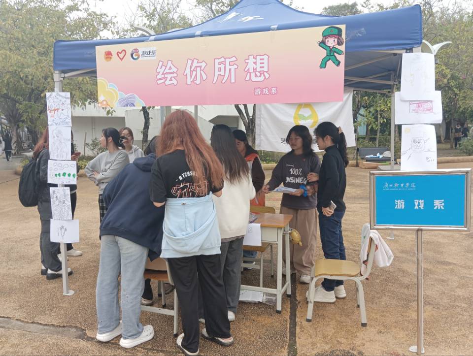 雷锋月|游戏系“艺术扶苗”服务队开展摆摊绘画活动